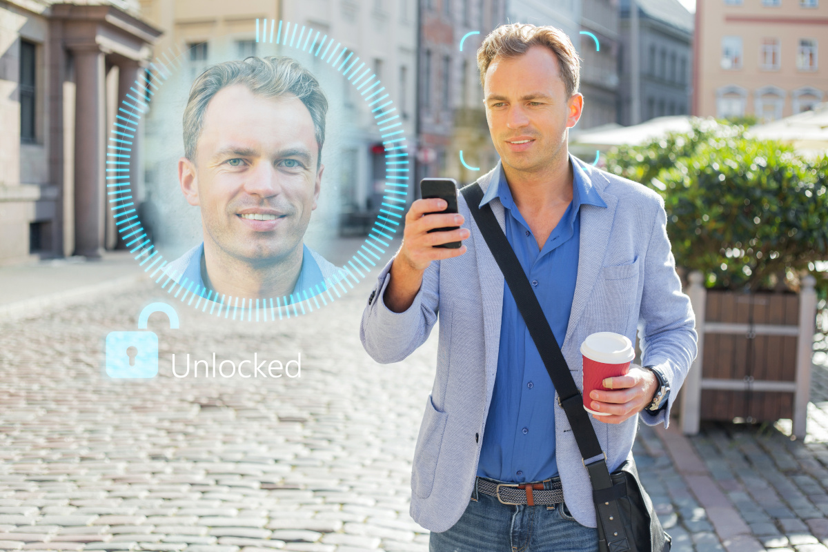 A man unlocking his phone with facial recognition technology