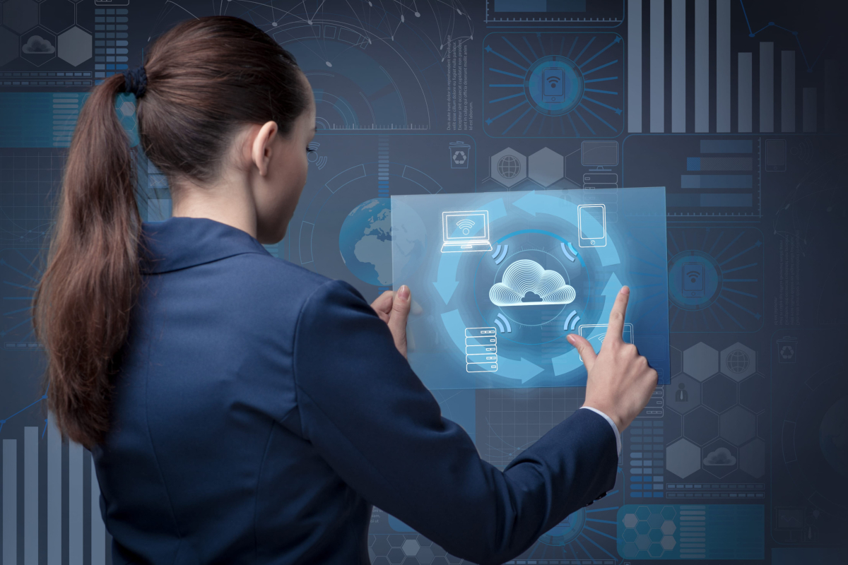 Woman looking at a digital cloud computing concept.
